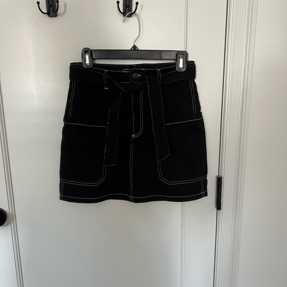 Black mini skirt with white stitching